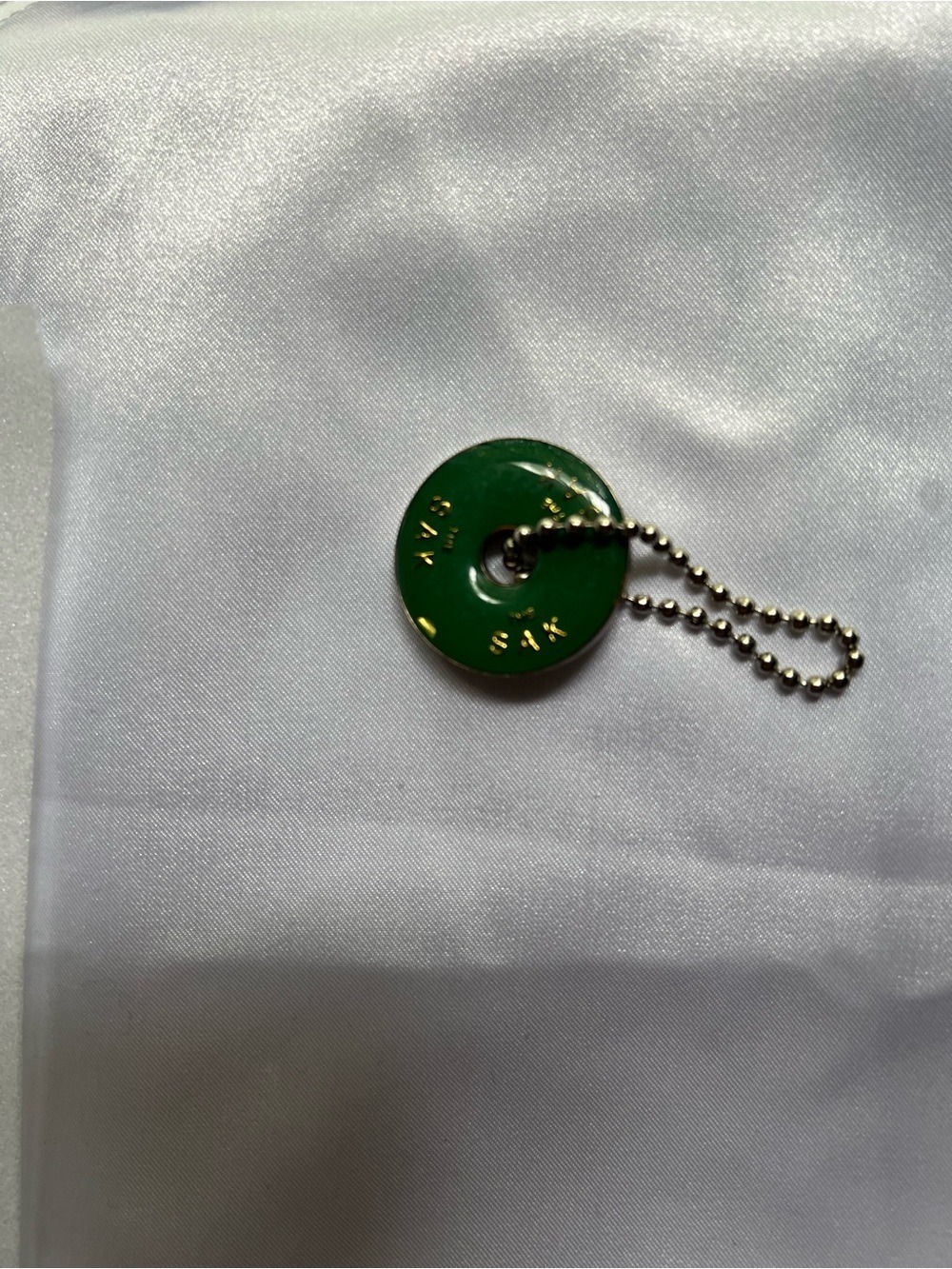The Sak Green Round Key/Card Holder with Gold Bead Chain